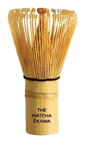 A bamboo whisk with fine curled tines, bound with black thread at the base